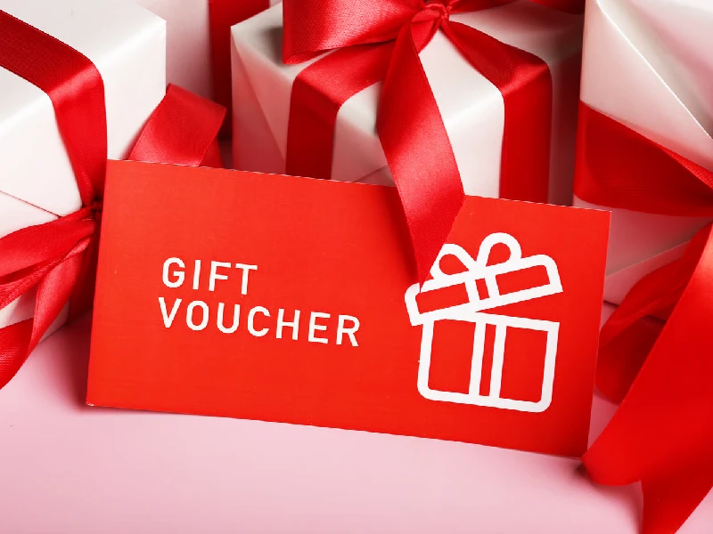 gift certificate coupon voucher lies on gifts